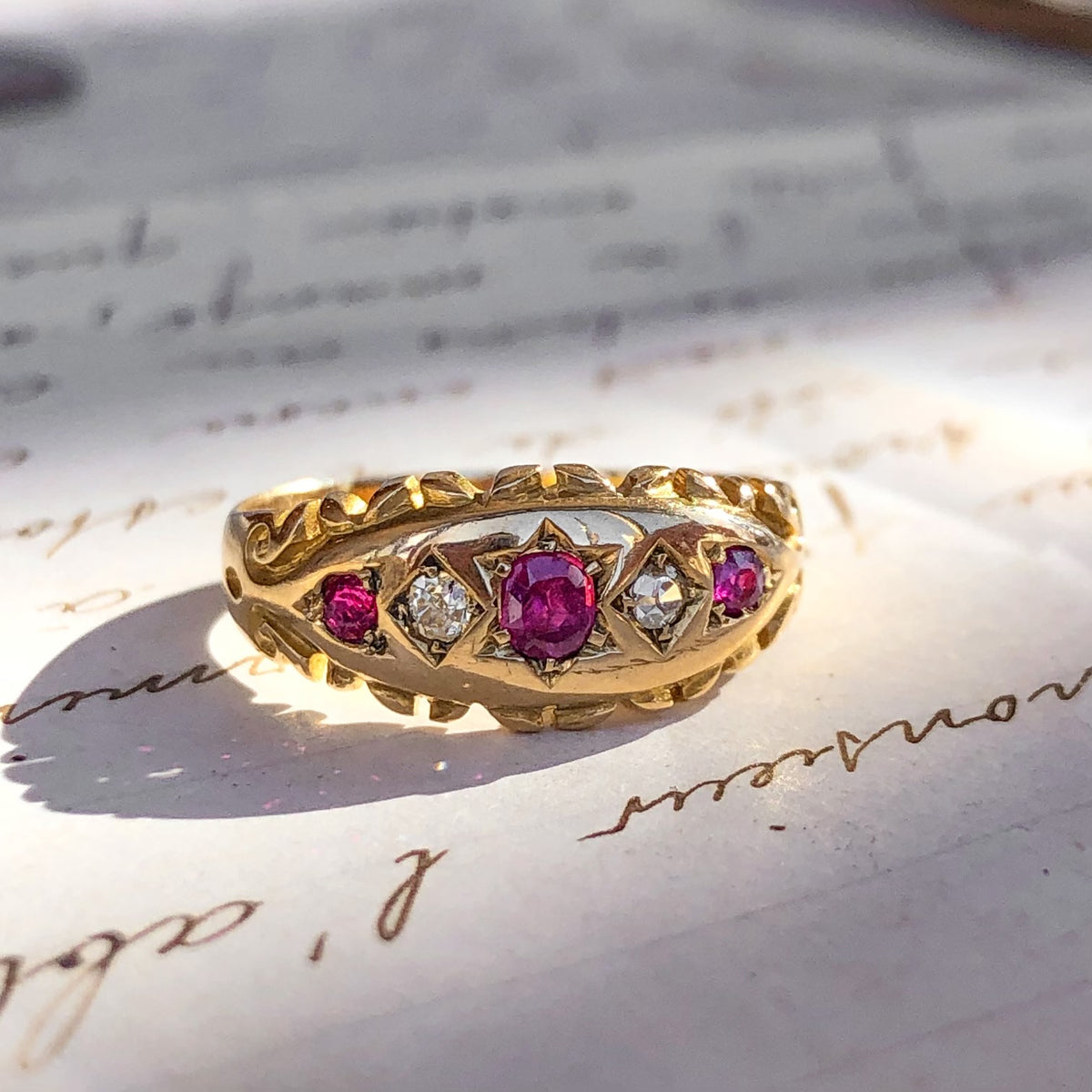 1899 Isolde, 18ct Antique Ruby Diamond Band