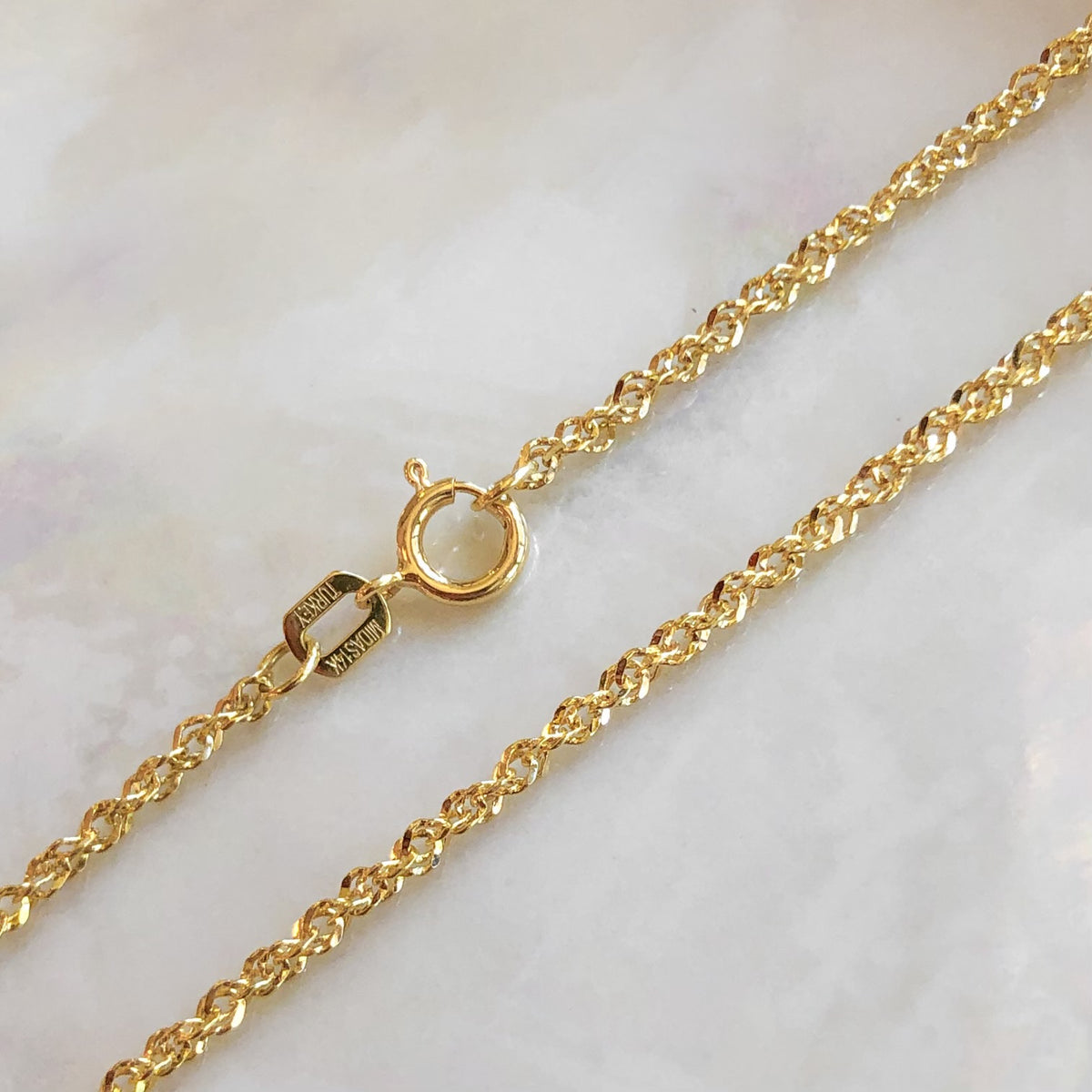 Mel, 1.7mm Diamond Cut Singapore Chain